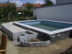 Neugestaltung des Swimmingpools mit Granitstelen